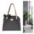 Black and white polka dot handbag with a bow
