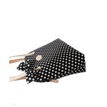 Black and white polka dot handbag with a bow