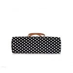 Black and white polka dot handbag with a bow