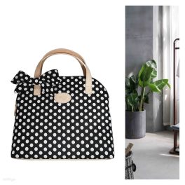 Schwarz-weiße gepunktete Handtasche mit eine Schleife